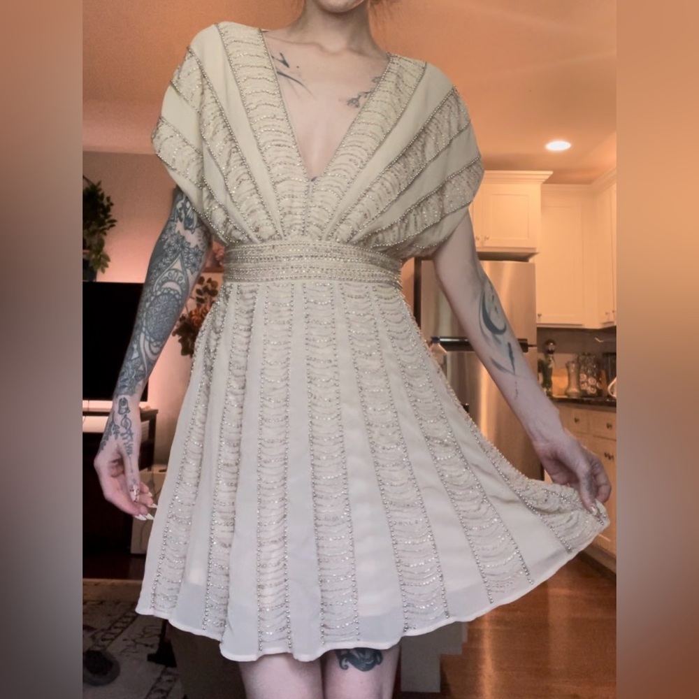 Embroidered low neck open back dress
